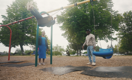 a family plays at a park
