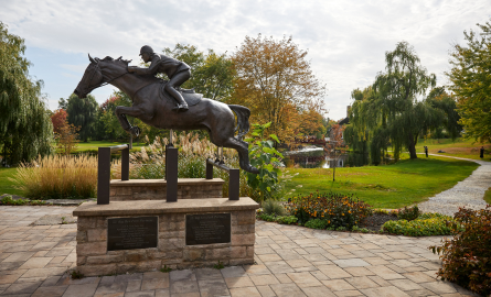 a bronze statue of a leaping horse