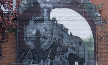 a mural depicting a steam powered train