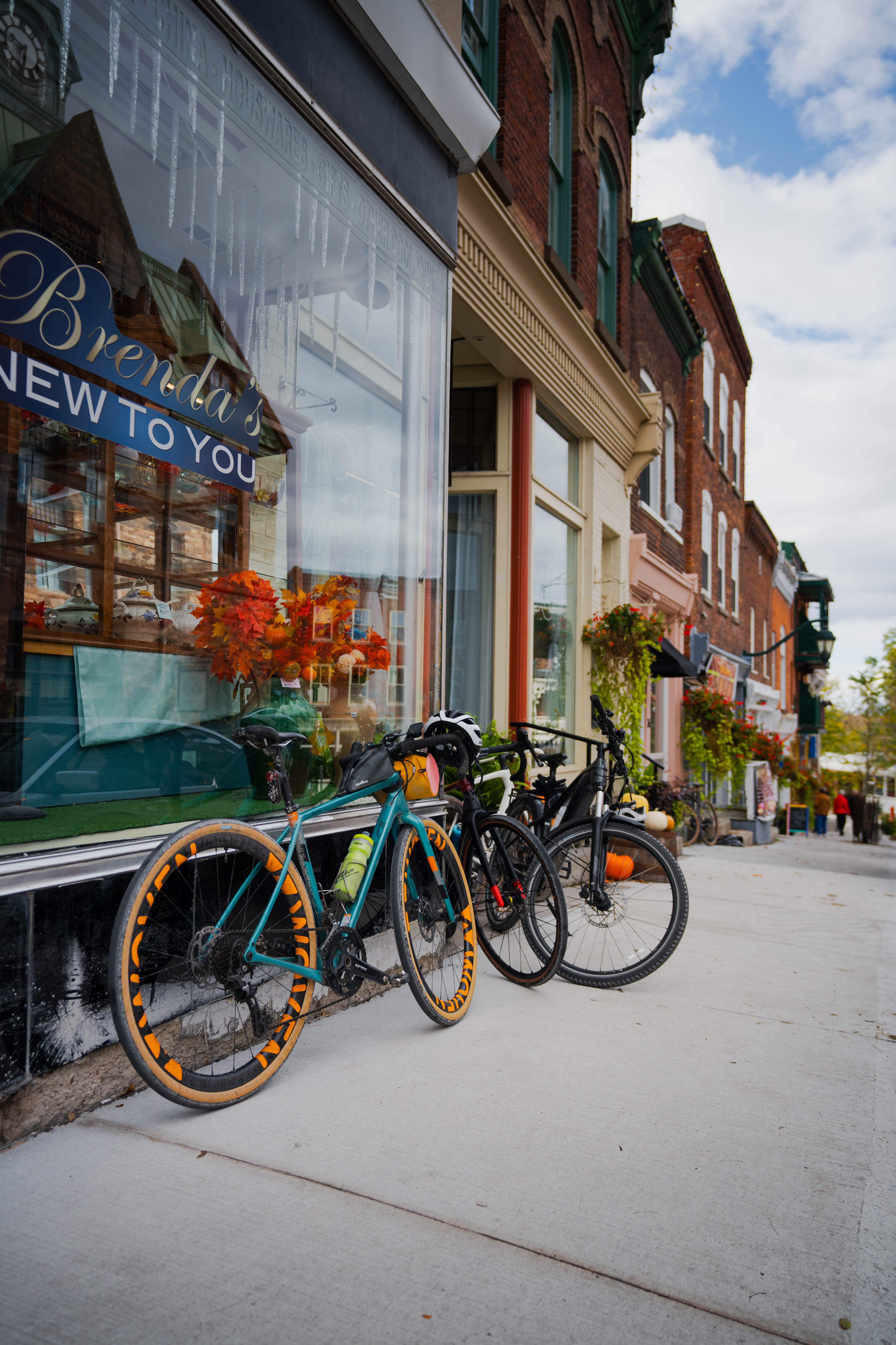 bicyles parked outside of shops and restaurants