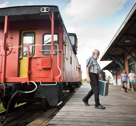 a man exiting a vintage train